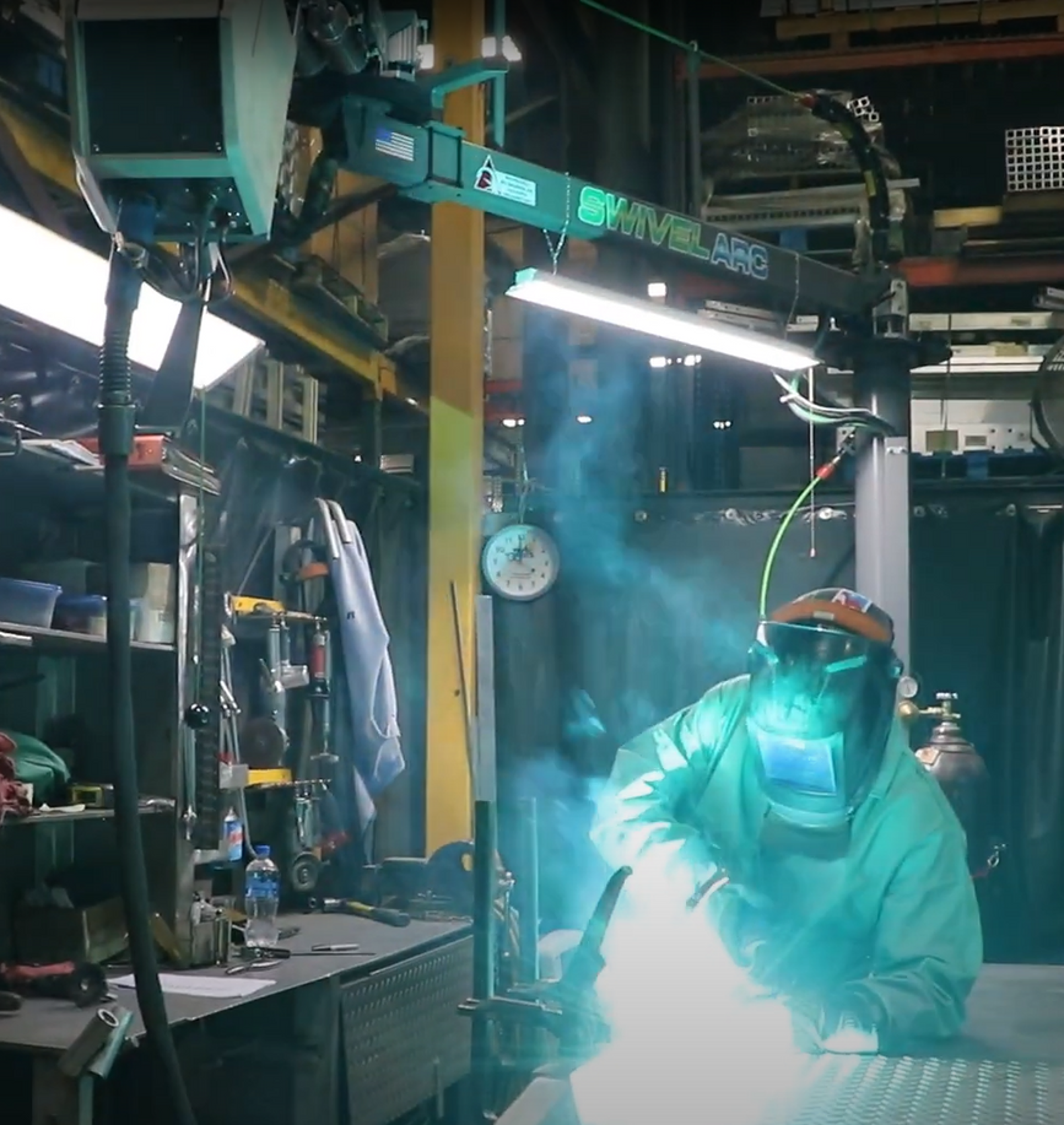 Welder using a boom system to enhance the welding process.